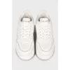 White high-heeled sneakers