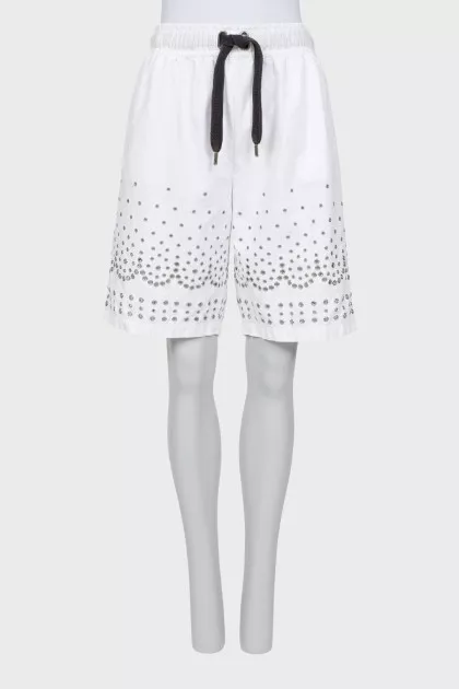 Shorts decorated with eyelets