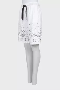 Shorts decorated with eyelets