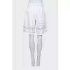 Shorts decorated with eyelets