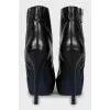 Leather ankle boots decorated with zippers