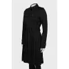 Black trench coat with pleated hem