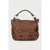 Leather satchel bag with tag