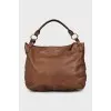 Leather satchel bag with tag