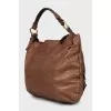 Leather satchel bag with tag