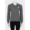 Gray V-neck sweater