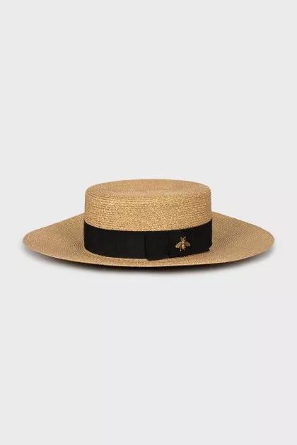 Golden hat with ribbon