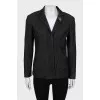 Jacket in small print with brooch