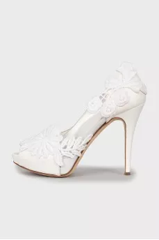 White shoes decorated with flowers