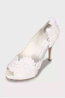White shoes decorated with flowers