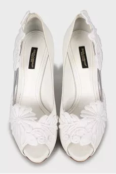 White shoes decorated with flowers