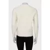 Knitted sweater decorated with sequins