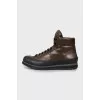 Men's leather boots with embossed logo