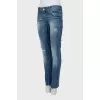 Low-rise embellished jeans