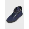 Textile sneakers decorated with chain