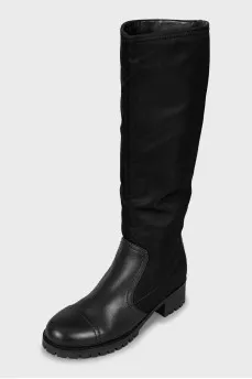 Black boots made of leather and textile