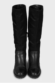 Black boots made of leather and textile