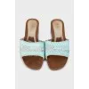 Wooden slippers decorated with sequins