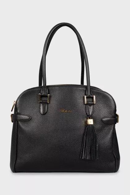 Leather bag decorated with buckles