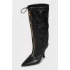 Leather boots with zipper and tag
