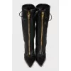 Leather boots with zipper and tag