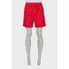 Men's red shorts with tag