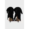 Black sandals decorated with a bow