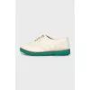 Leather brogues with green sole