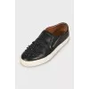 Leather slip-ons decorated with stones