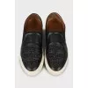 Leather slip-ons decorated with stones