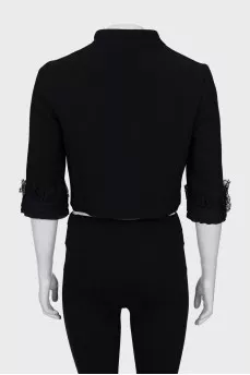 Cropped jacket decorated with lace