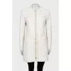 White jacket decorated with fringe