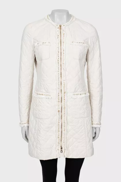 White jacket decorated with fringe