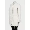 White jacket decorated with fringe