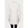 White jacket decorated with fringe