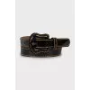 Lacquered belt with contrasting stitching