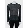 Knitted sweater decorated with weaving
