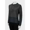 Knitted sweater decorated with weaving