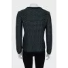 Knitted sweater decorated with weaving
