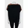 Knitted sweater with leather insert