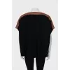 Knitted sweater with leather insert