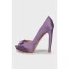 Purple shoes decorated with a bow