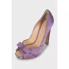 Purple shoes decorated with a bow