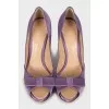 Purple shoes decorated with a bow