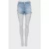 Blue denim shorts with ripped effect