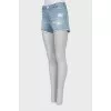 Blue denim shorts with ripped effect