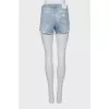 Blue denim shorts with ripped effect
