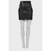 Leather mini skirt with oblique zipper