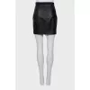 Leather mini skirt with oblique zipper