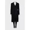 Coat with pleated back